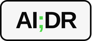 AI;DR chip, black on white with a green semicolon